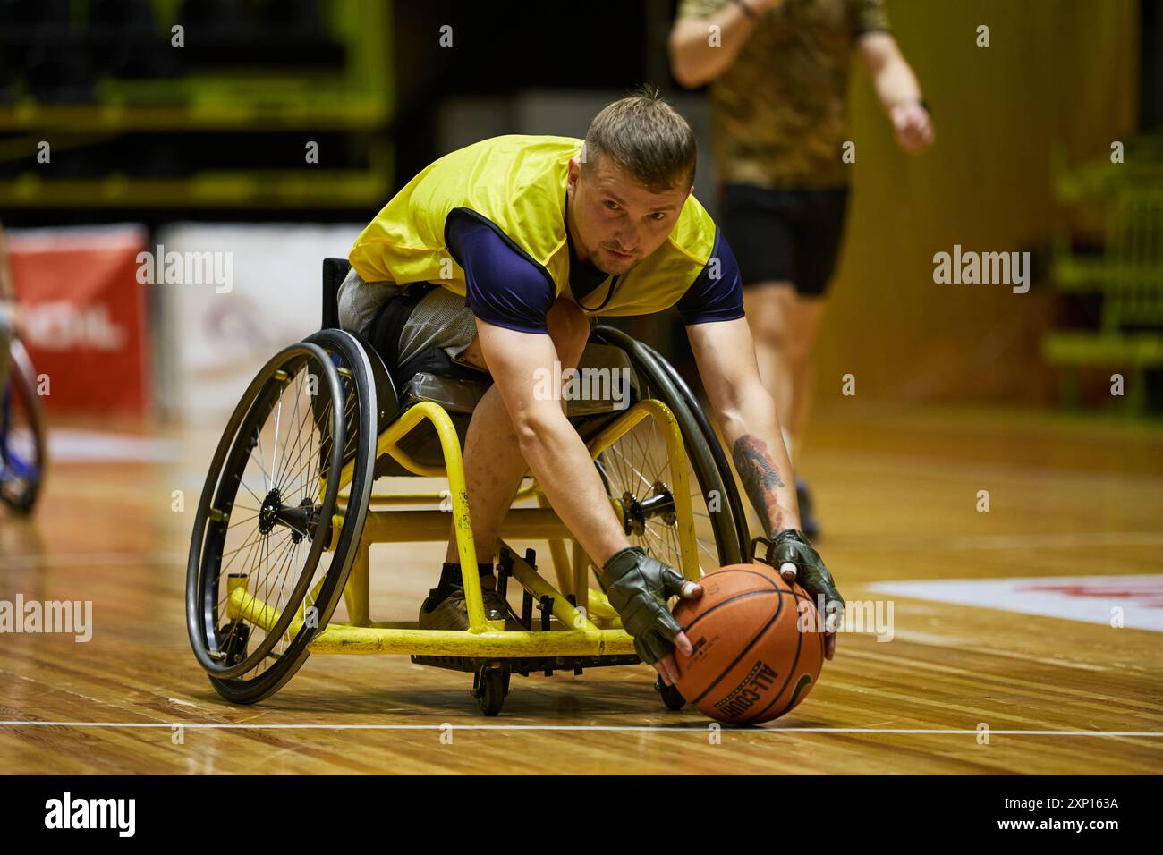 Athlete with amputation playing adaptive basketball in a wheelchair ...