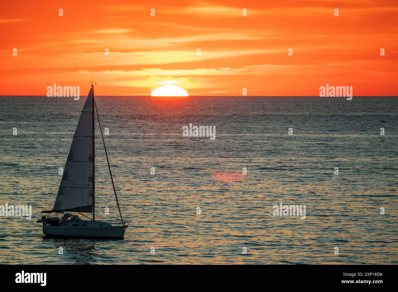 Sailboat sunset in ocean hi-res stock photography and images - Alamy