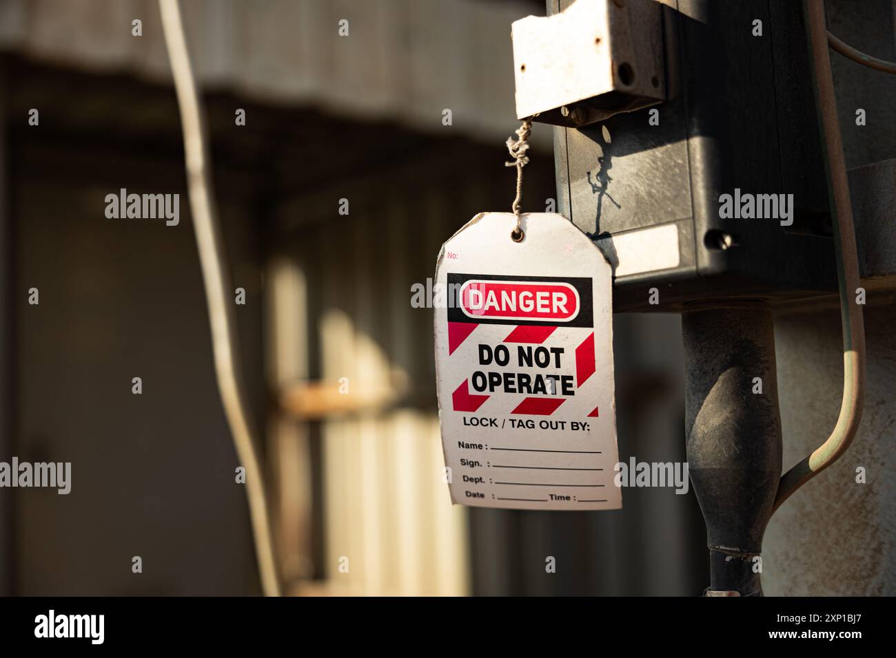 Danger tag, do not operate, this tag lock to be removed only by person signed on back. Lock out for electrical maintenance Stock Photo