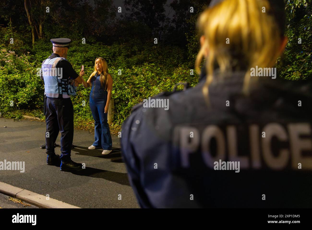 Liverpool, UK. 02 AUG, 2024. A women argues with a Police Liasion ...