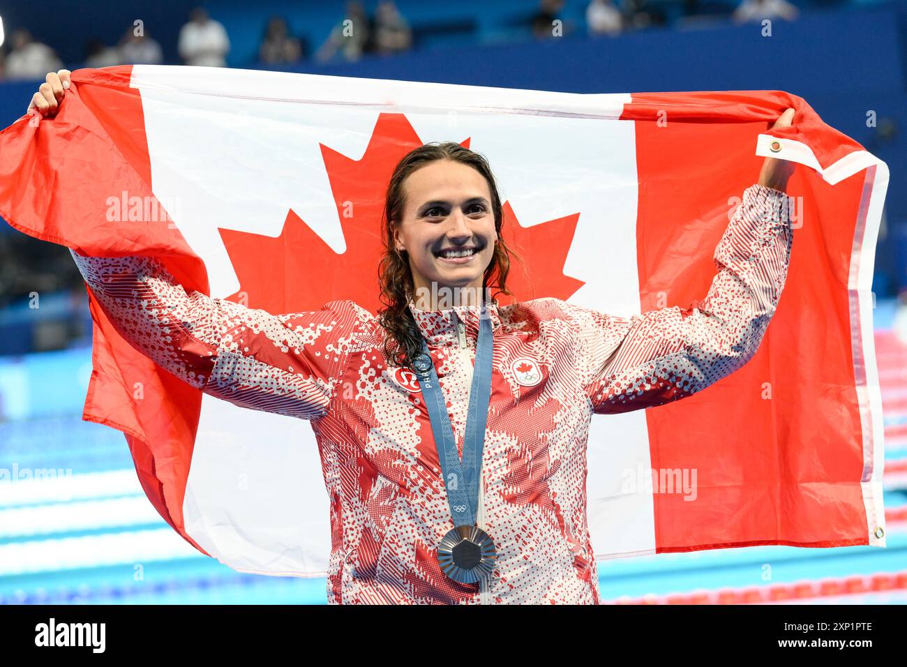 Kylie Masse of Canada celebrates during the medal ceremony of the 200m