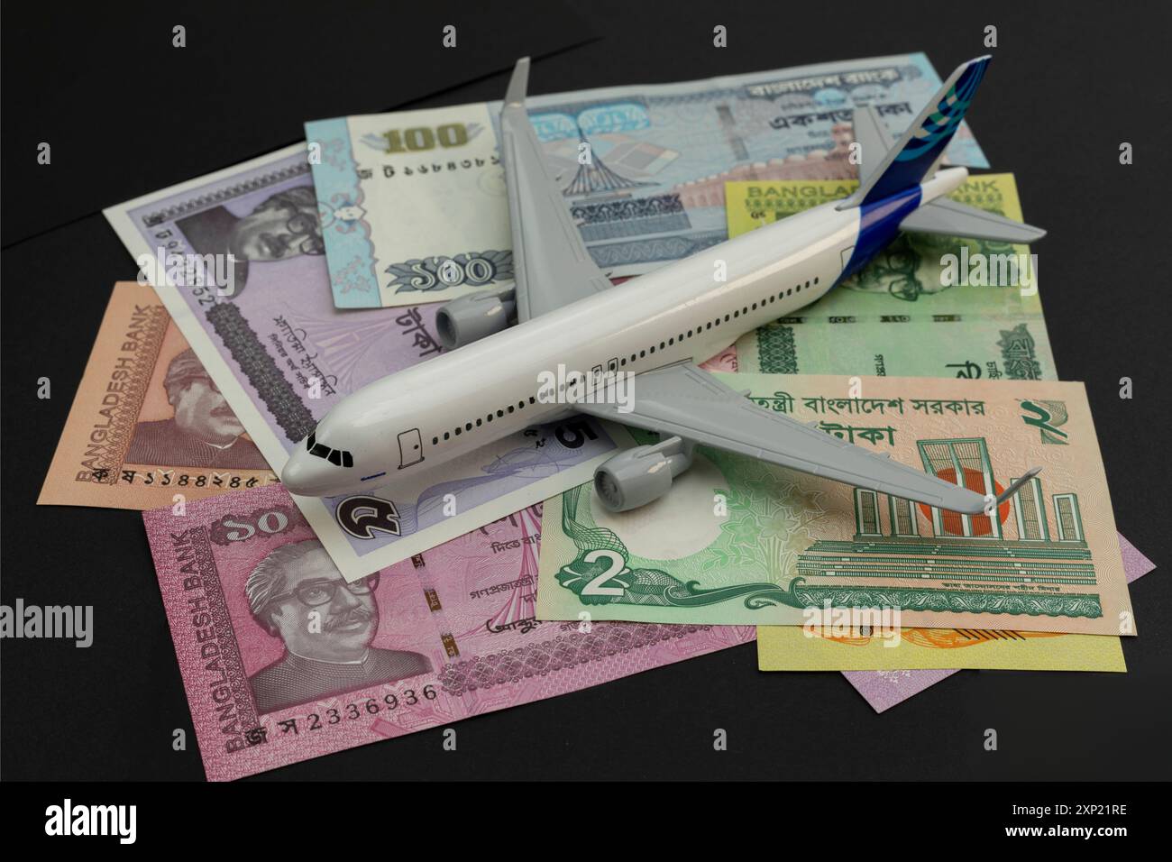 Airplane Model and Bangladeshi Taka Currency Stock Photo