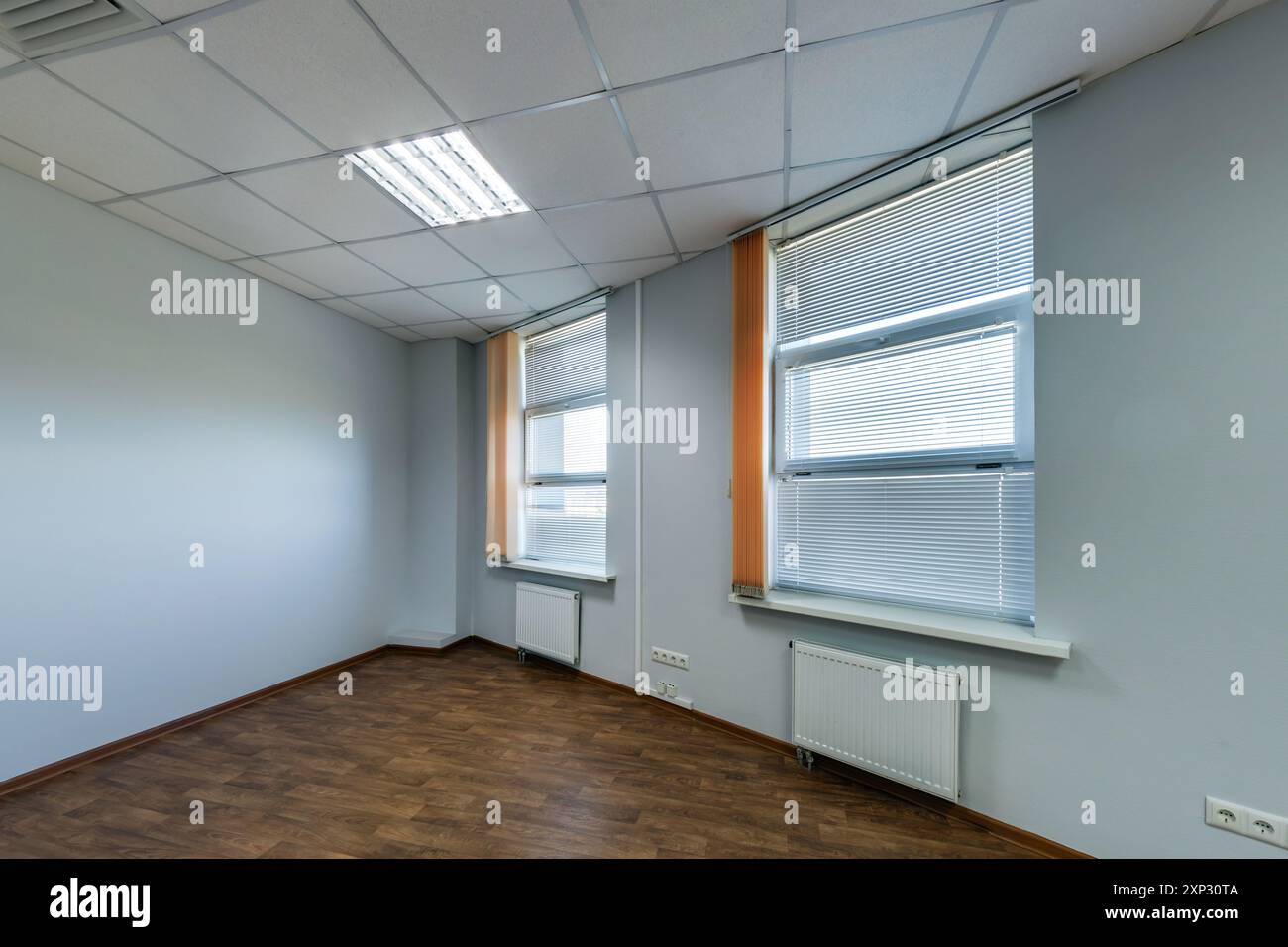 panorama view in empty modern office hall with sunlight in windows. Stock Photo