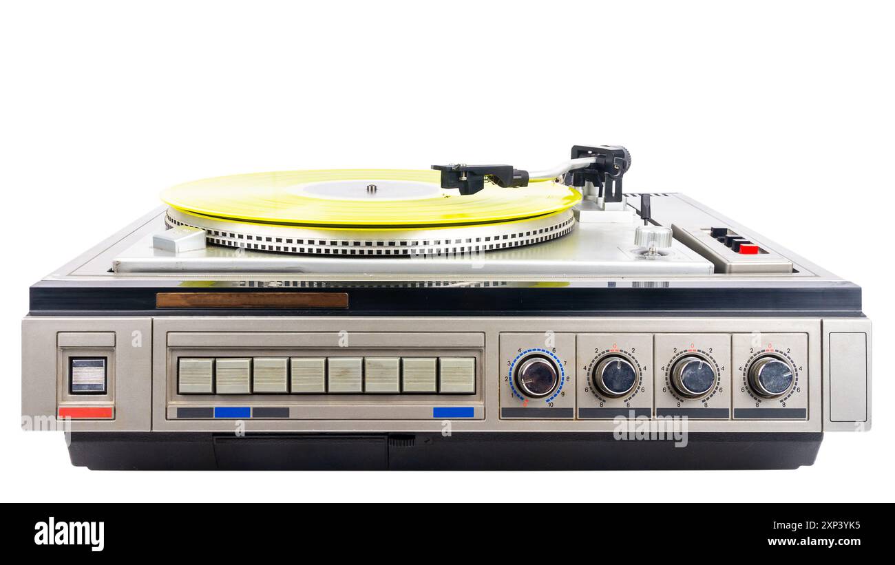Vintage turntable record player with yellow vinyl isolated on white ...