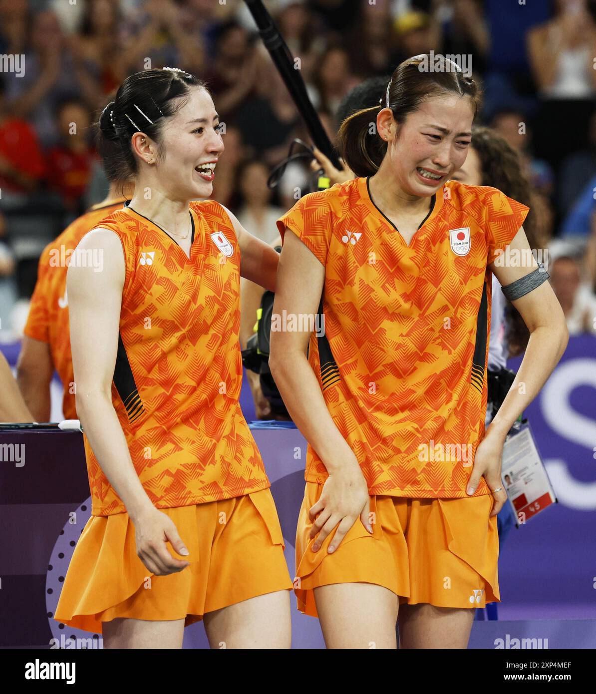 Chiharu Shida (L) and Nami Matsuyama of Japan react after beating
