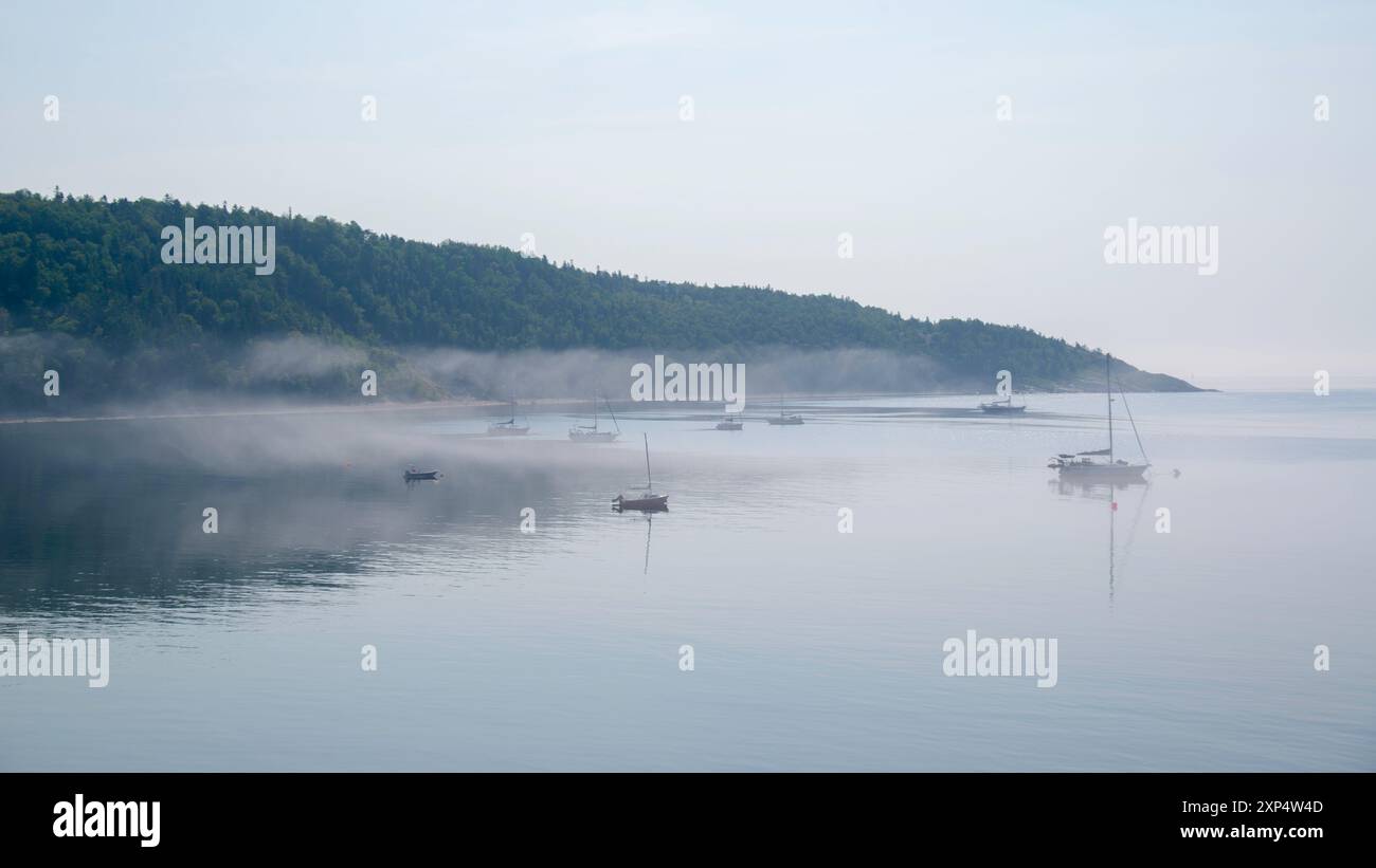 Tadoussac, Canada - July 27 2024: Morning mist in Tadoussac Bay Stock Photo