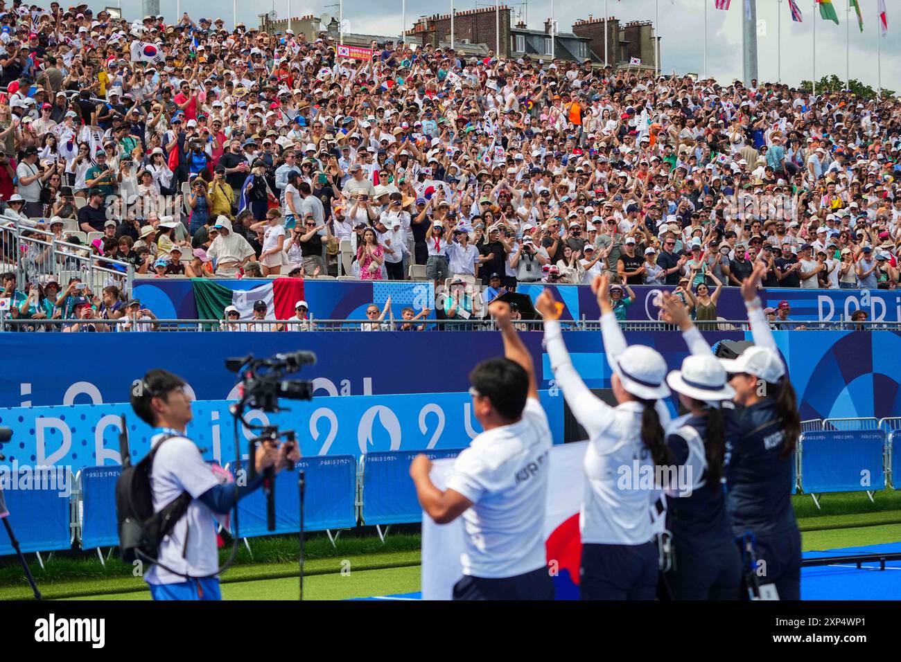 Paris, France. 3rd Aug, 2024. Spectators cheer for the medalist of the ...