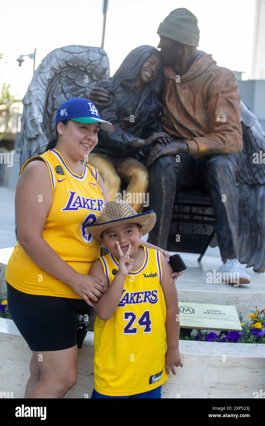Los Angeles, California, USA. 3rd Aug, 2024. Fans take photos of the newly  unveiled statue of late Los Angeles Lakers star Kobe Bryant and his daughter,  Gigi Bryant, outside Crypto.com Arena August.
