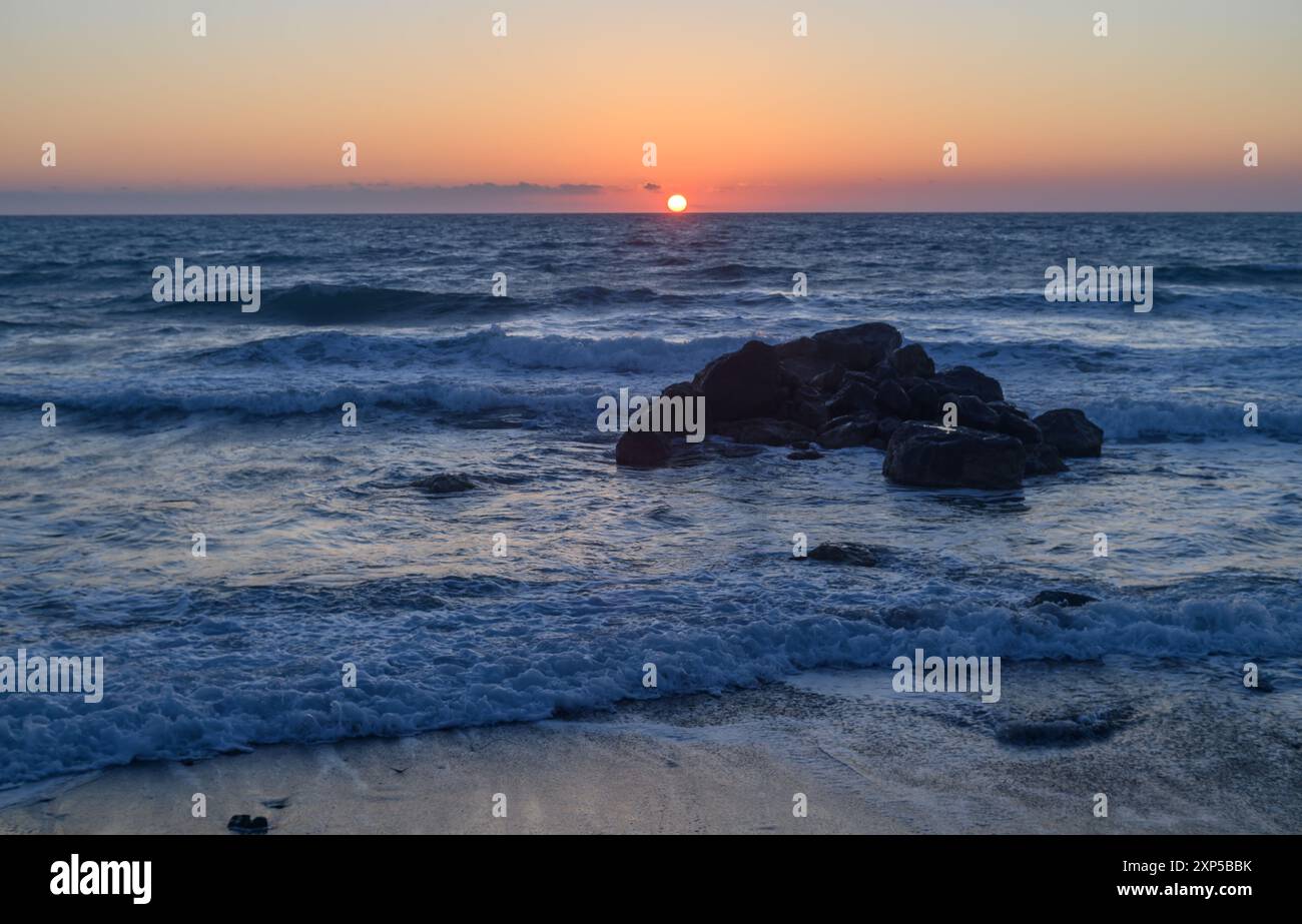 waves of the sea break on the rocks. Mediterranean Sea near the small ...