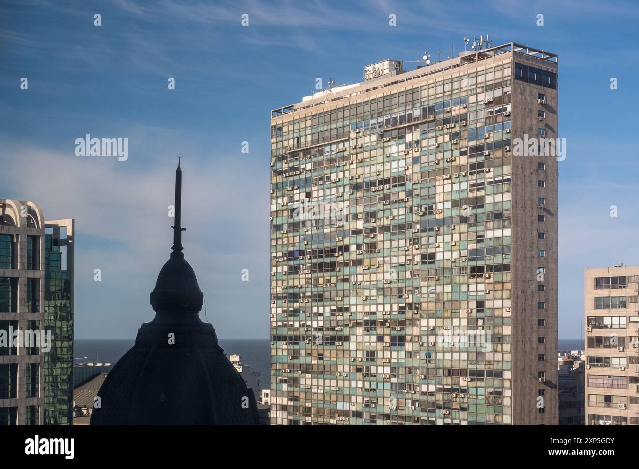 High-rise buildings under a clear blue sky overlooking the ocean Stock ...