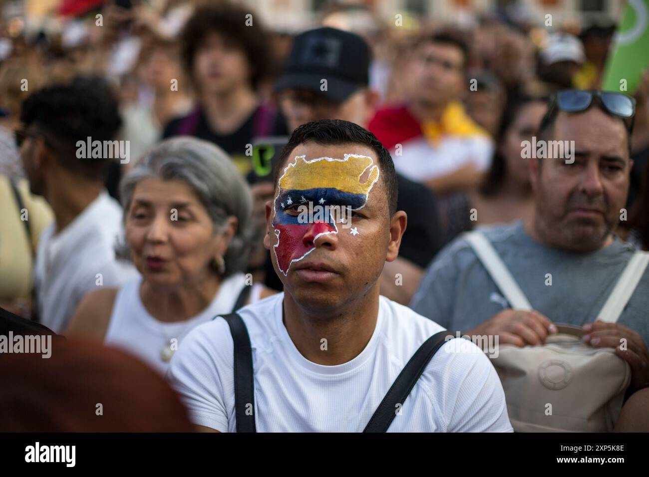 Madrid, Madrid, Spain. 3rd Aug, 2024. A protester has his face painted with the map in the colors of the Venezuelan flag, during a protest at the Puerta del Sol in Madrid, called by the Venezuelan community in Madrid, to demand the presidency of Edmundo Gonzalez as president of Venezuela.The Venezuelan community living in Madrid called for a protest to join the massive demonstration in Venezuela called by Maria Corina Machado to promote Edmundo Gonzalez as president of Venezuela. Credit: ZUMA Press, Inc./Alamy Live News Stock Photo