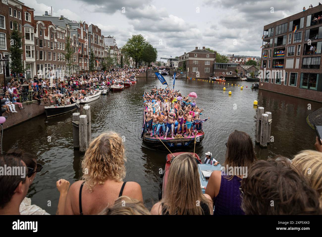 Amsterdam, North Holland, Netherlands. 3rd Aug, 2024. A Pride float is celebrated as it moves through Amsterdam's canals. On August 3, 2024, several hundred thousand participants, and 80 floats, participated in Amsterdam Pride's 27th Canal Parade. This year's theme was ''Together' (Credit Image: © James Petermeier/ZUMA Press Wire) EDITORIAL USAGE ONLY! Not for Commercial USAGE! Stock Photo