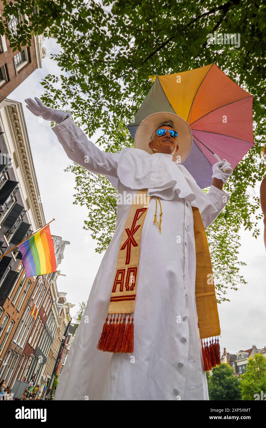 Amsterdam, North Holland, Netherlands. 3rd Aug, 2024. An Amsterdam Pride celebrant dressed as the Pope poses to be photographed. On August 3, 2024, several hundred thousand participants, and 80 floats, participated in Amsterdam Pride's 27th Canal Parade. This year's theme was ''Together' (Credit Image: © James Petermeier/ZUMA Press Wire) EDITORIAL USAGE ONLY! Not for Commercial USAGE! Stock Photo