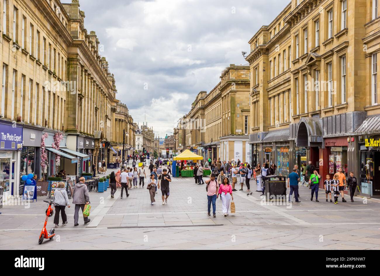 People walking and shopping in Grainger street in Newcastle upon Tyne, England Stock Photo