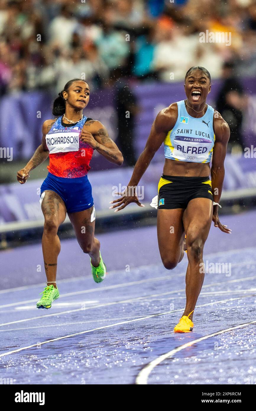 Julien Alfred (LCA) competing in the Women's 100m Final, wins the gold medal with Sha'carri Richardson (USA) silver at the 2024 Olympic Summer Games. Stock Photo