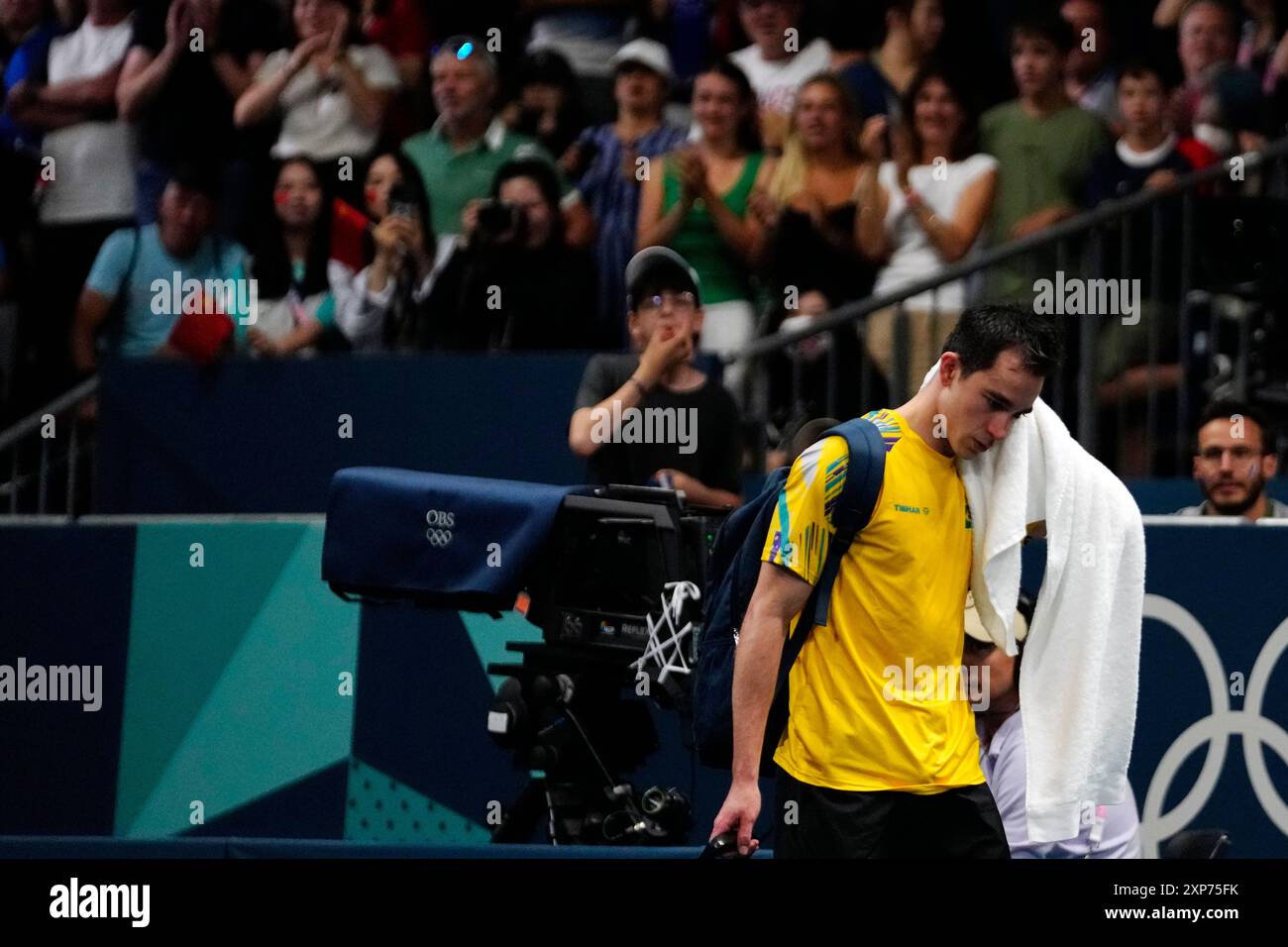 Brazil's Hugo Calderano leaves the arena after losing by France's Felix ...