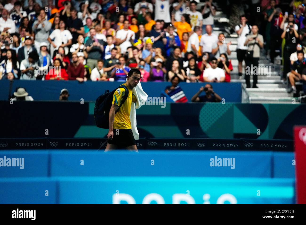 Brazil's Hugo Calderano leaves the arena after losing by France's Felix ...
