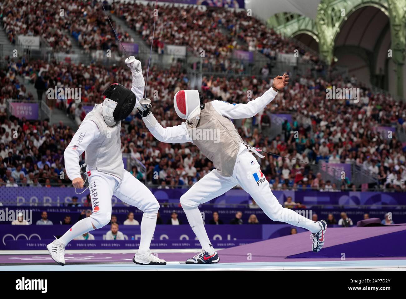 Japan's Kyosuke Matsuyama competes with France's Enzo Lefort in the men ...