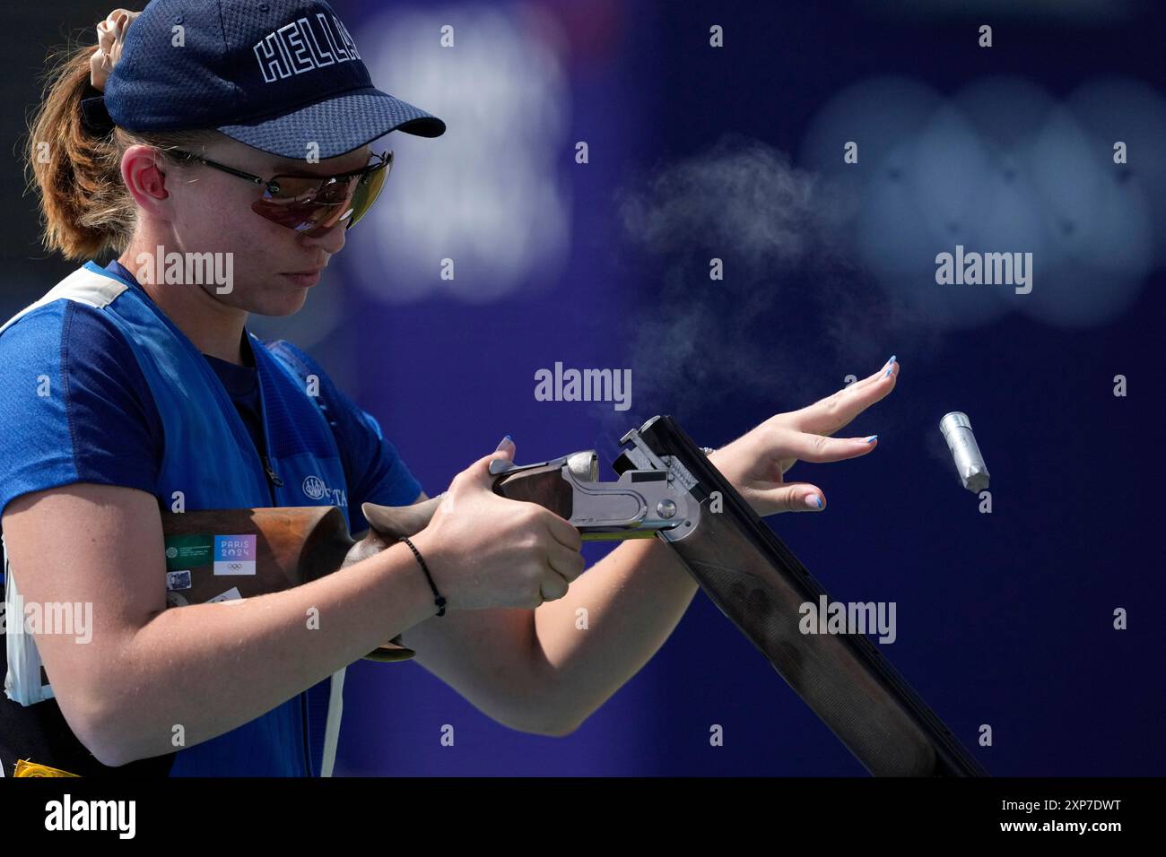 Greece's Emmanouela Katzouraki ejects empty cartridges from her gun as
