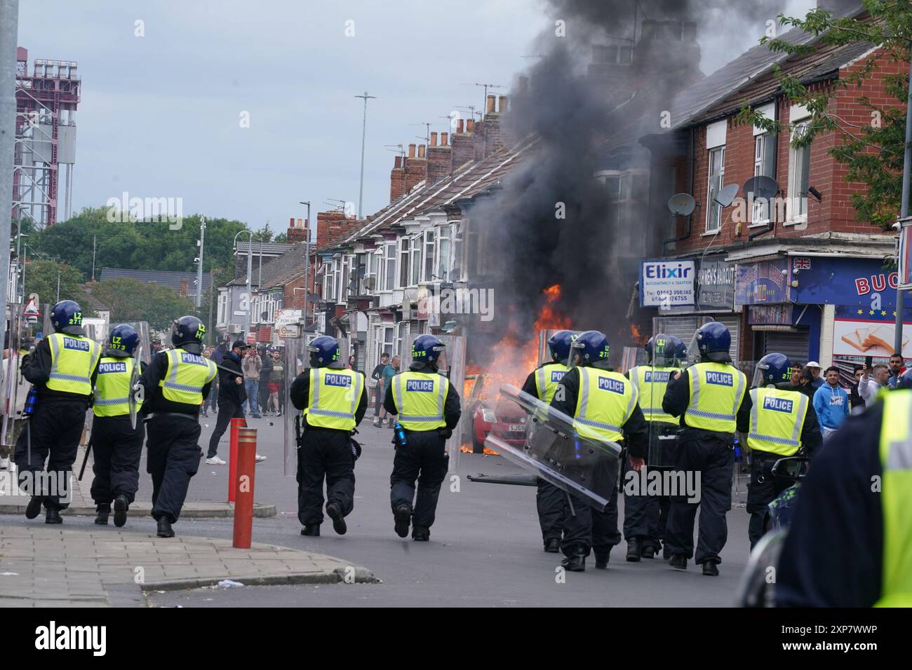 A car burns during an anti-immigration protest in Middlesbrough. Picture date: Sunday August 4, 2024. Stock Photo