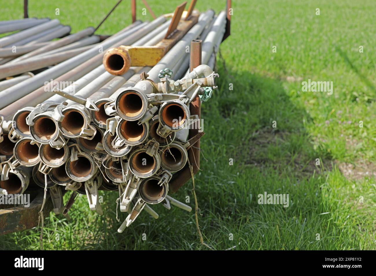 Water pipes irrigation on the field in agriculture Stock Photo - Alamy