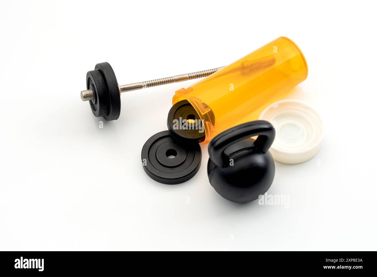 Exercise as Medicine Concept with Kettlebell, Weights, and Pill Bottle for Fitness Regimen as Healthcare, Preventative Medicine, and Wellness Strategy Stock Photo