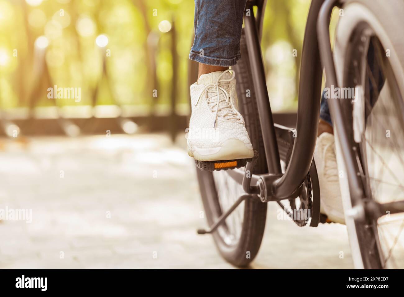 Foot Riding Away Feet On Pedals Of Unrecognizable Black Man Riding Bicycle In Park Stock ...