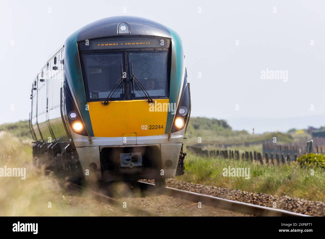 Irish Rail or "Iarnrod Eireann" train carriage moving or travelling on railway tracks. Wicklow, Ireland Stock Photo