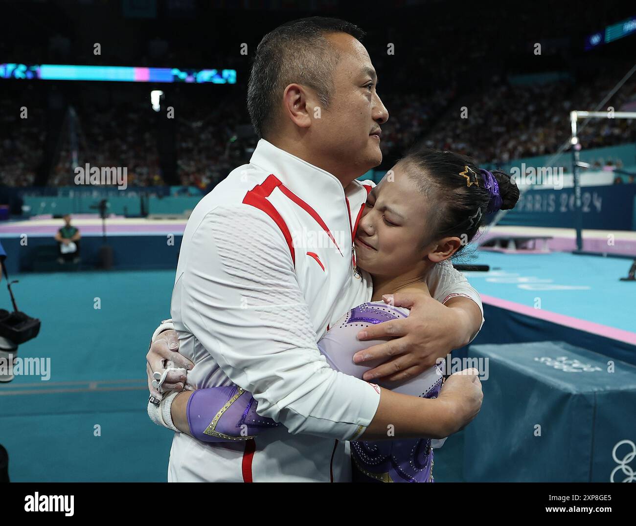 Paris, France. 4th Aug, 2024. Qiu Qiyuan (R) of China hugs with coach ...