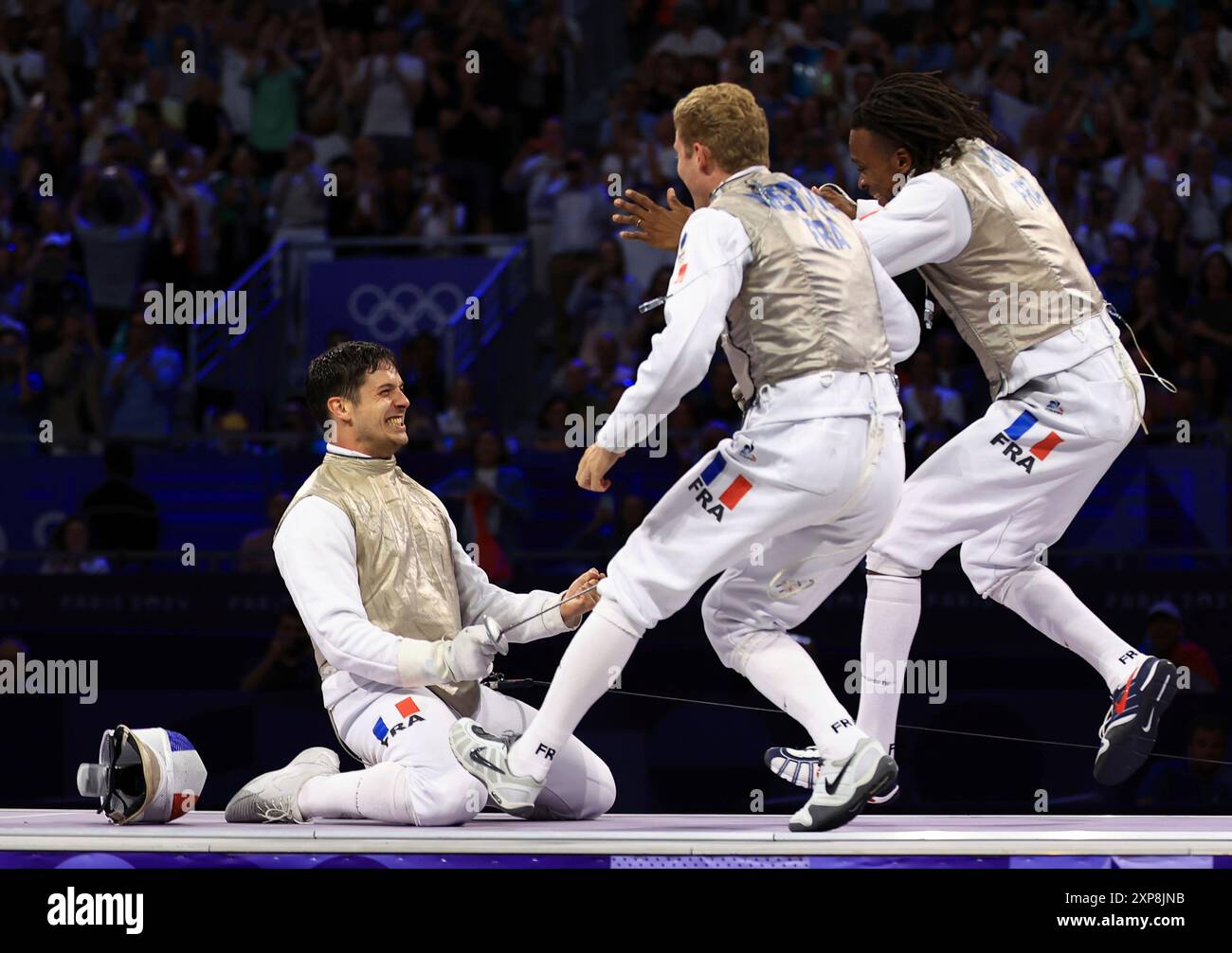 Philippe Riboud Members of France react after winning the men's fencing foil team match ...
