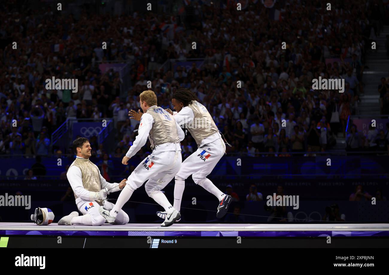 Philippe Riboud Members of France react after winning the men's fencing foil team match ...