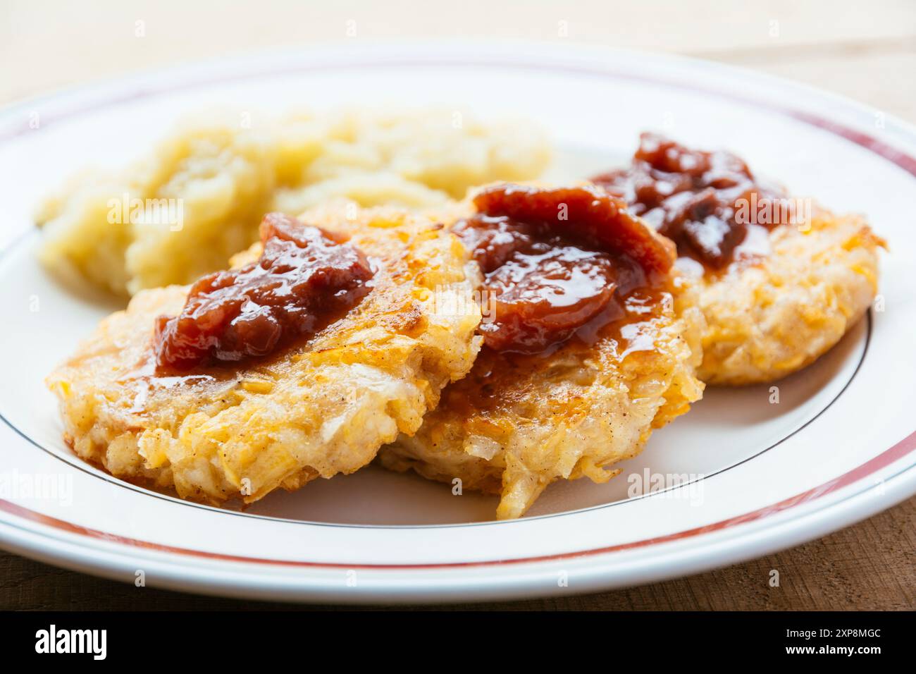 Rutabaga Rosti with Plum Chutney and Pear Puree Stock Photo