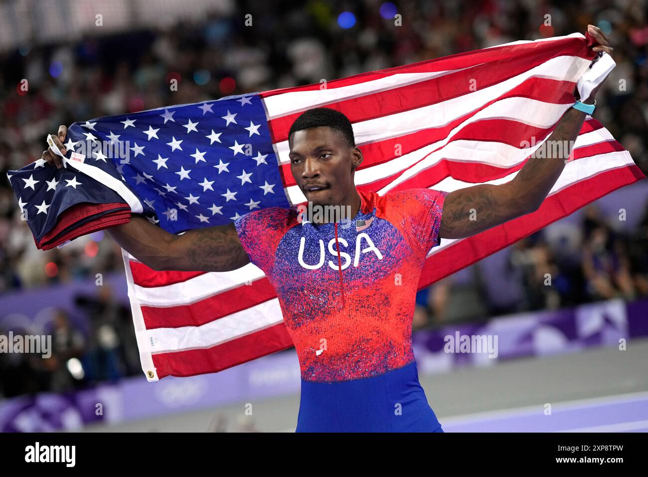 Fred Kerley, of the United States, celebrates after his third place