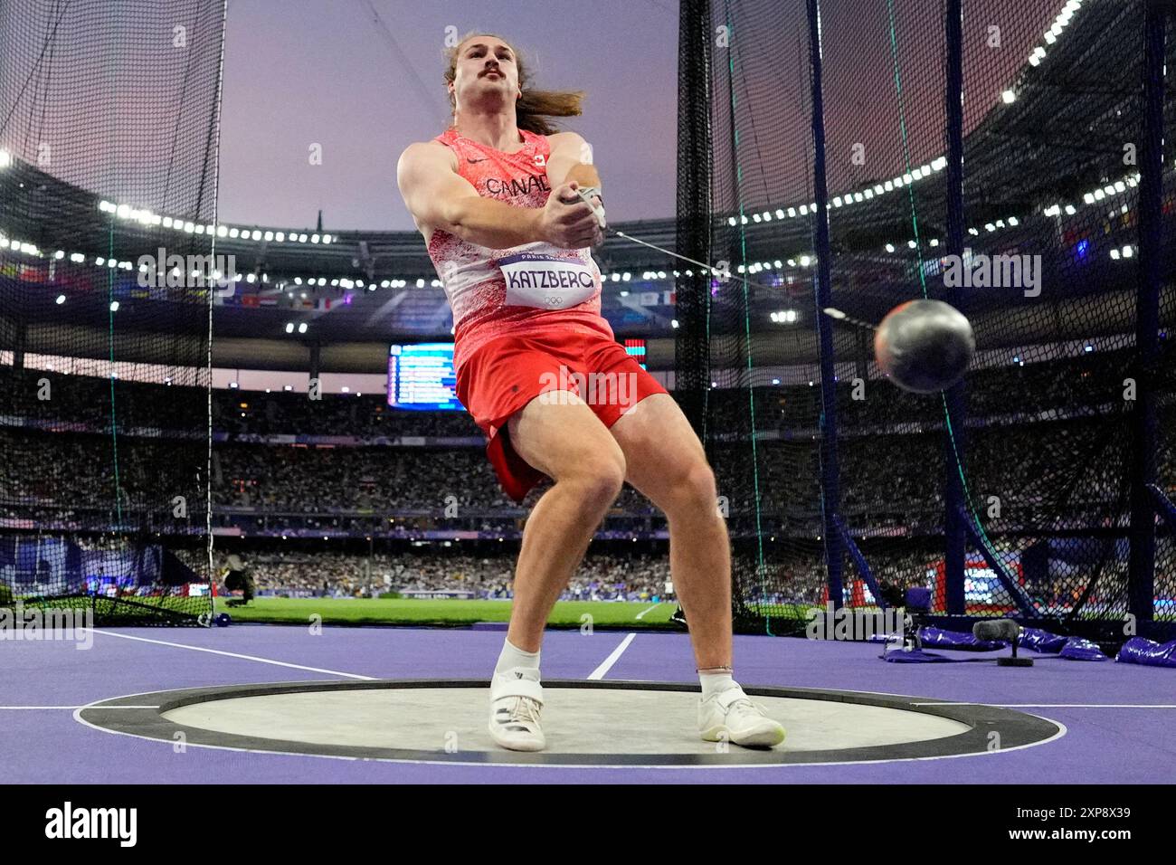 Ethan Katzberg, of Canada, competes in the men's hammer throw final at ...