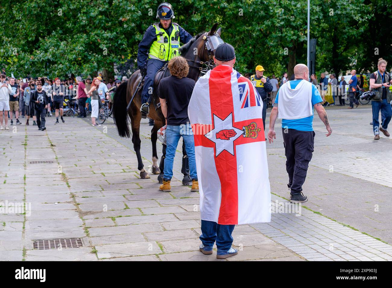 Bristol Riot - Police officers on horses are confronted by Far-right activists during an Enough is Enough protest in Castle Park, Bristol. 03-08-2024 Stock Photo