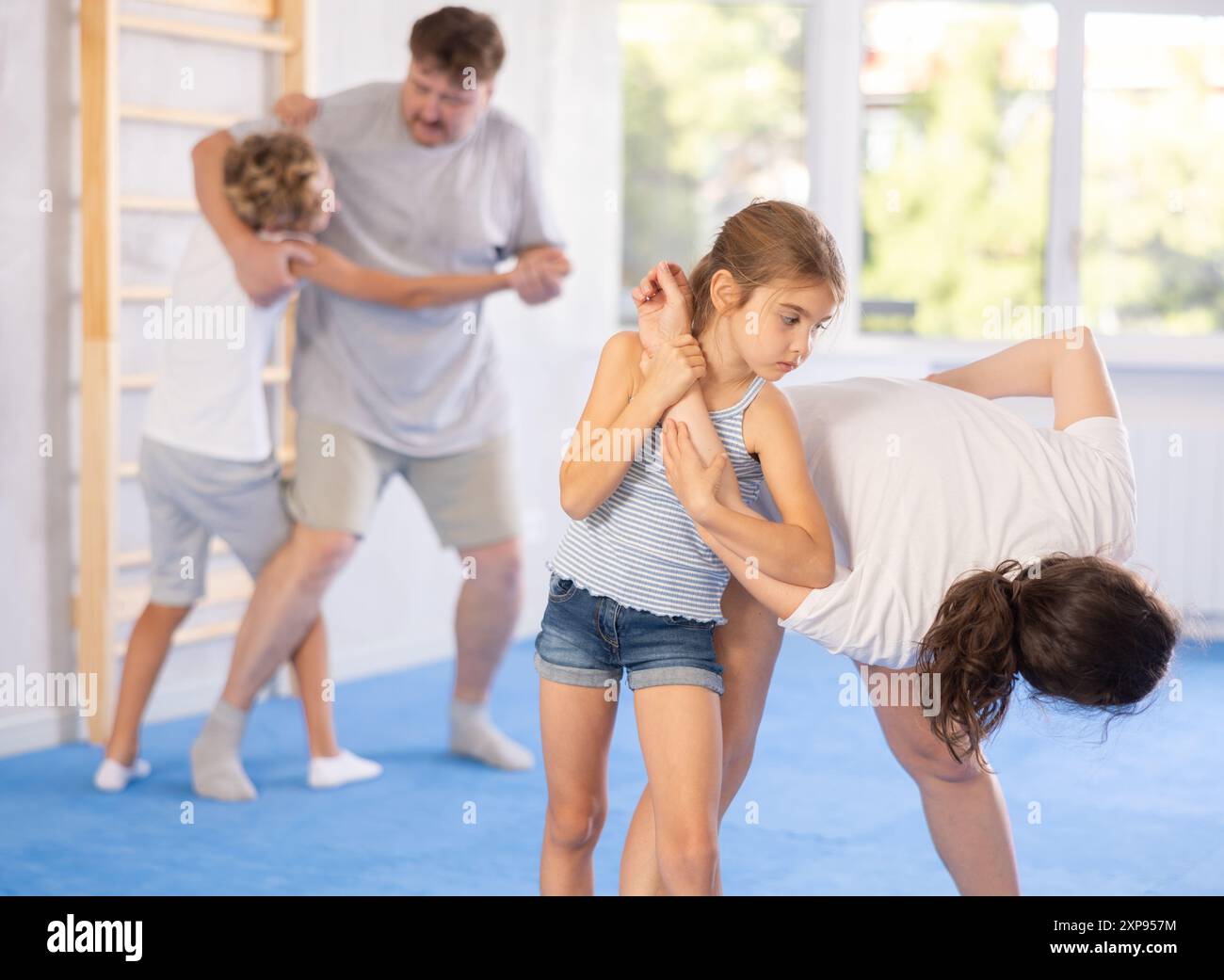Mother and daughter training self-defense techniques Stock Photo - Alamy