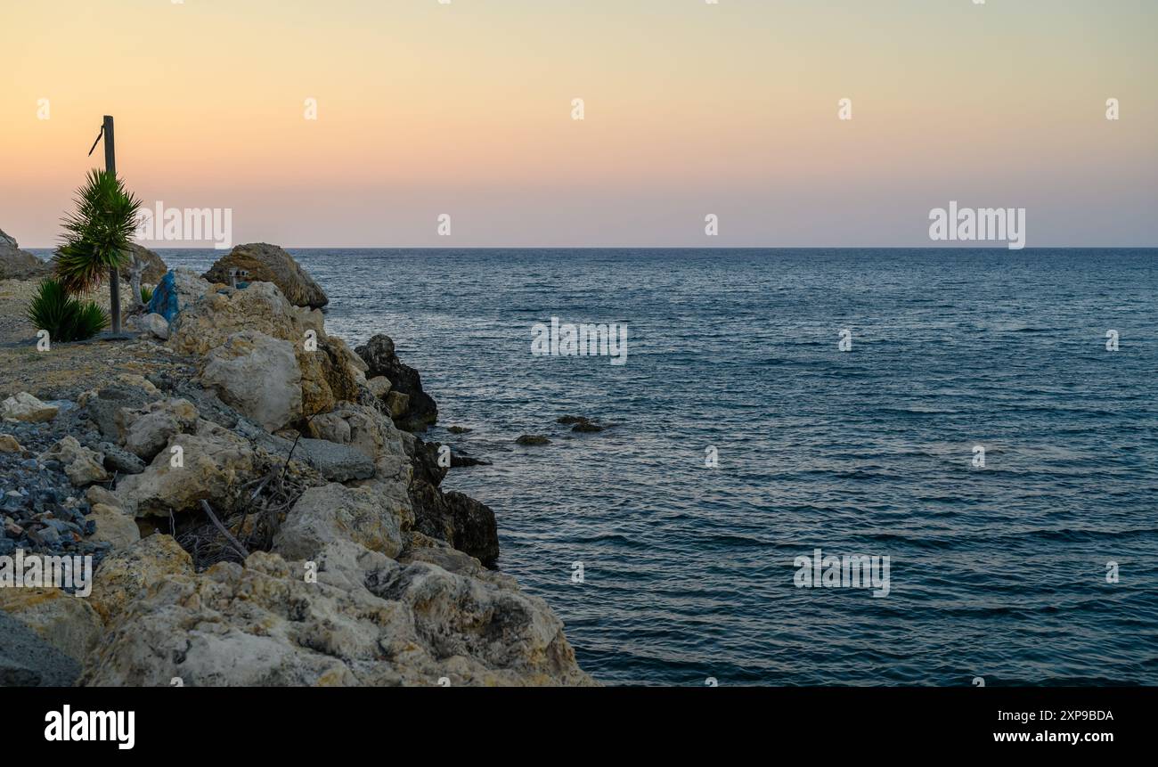 Rock formations near the beach with soft sunset light Stock Photo - Alamy