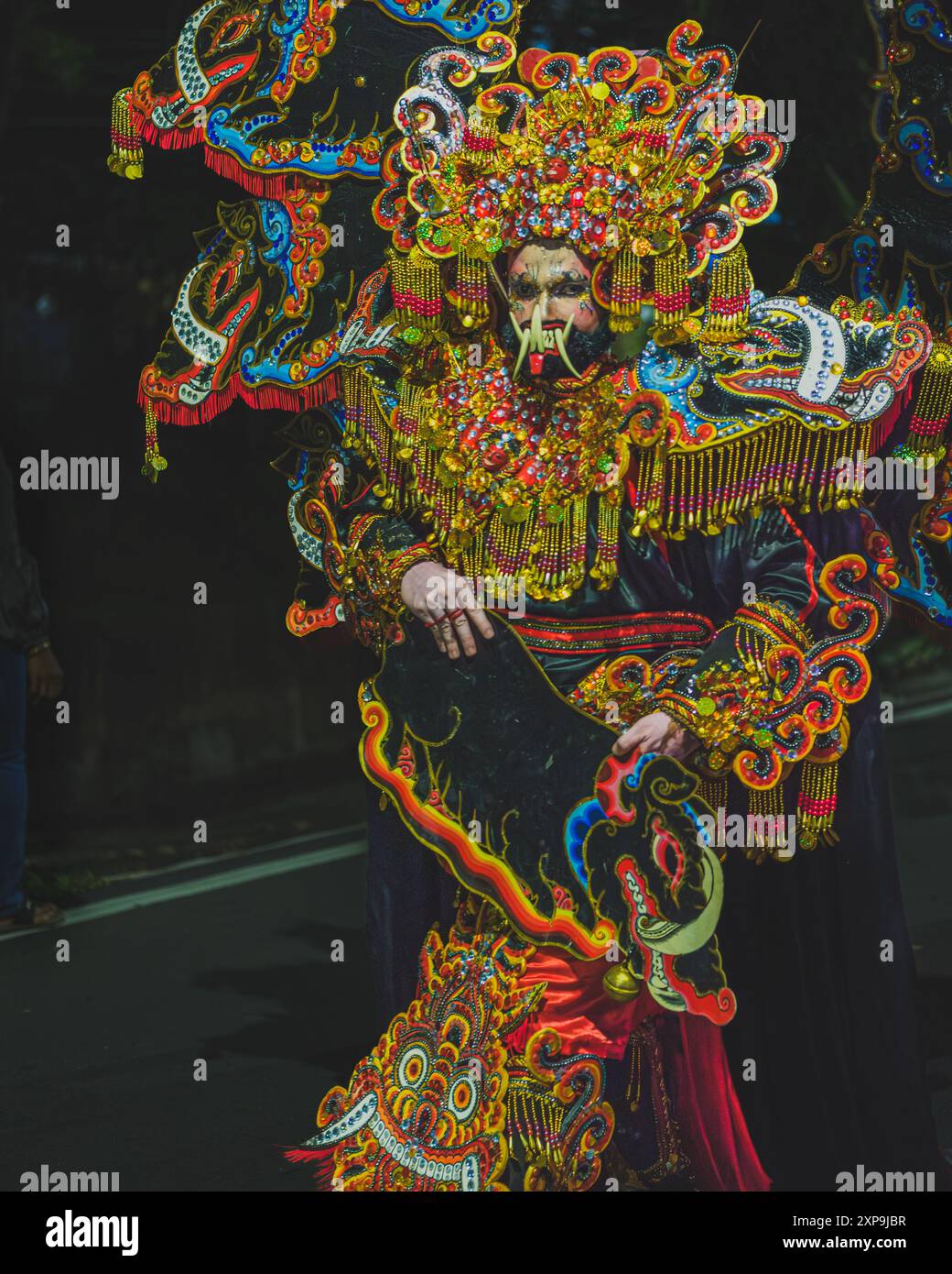 Balikpapan, Indonesia - June 5th, 2024. he walks down the street on a parade during the Indonesian cultural festival fashion show. Stock Photo