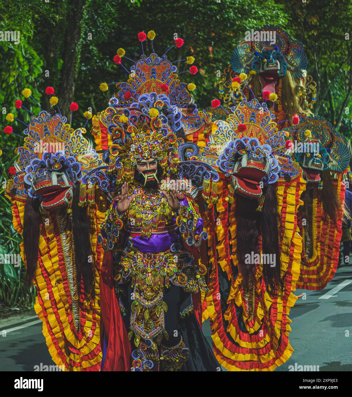 Balikpapan, Indonesia - June 5th, 2024. he walks down the street on a parade during the Indonesian cultural festival fashion show. Stock Photo