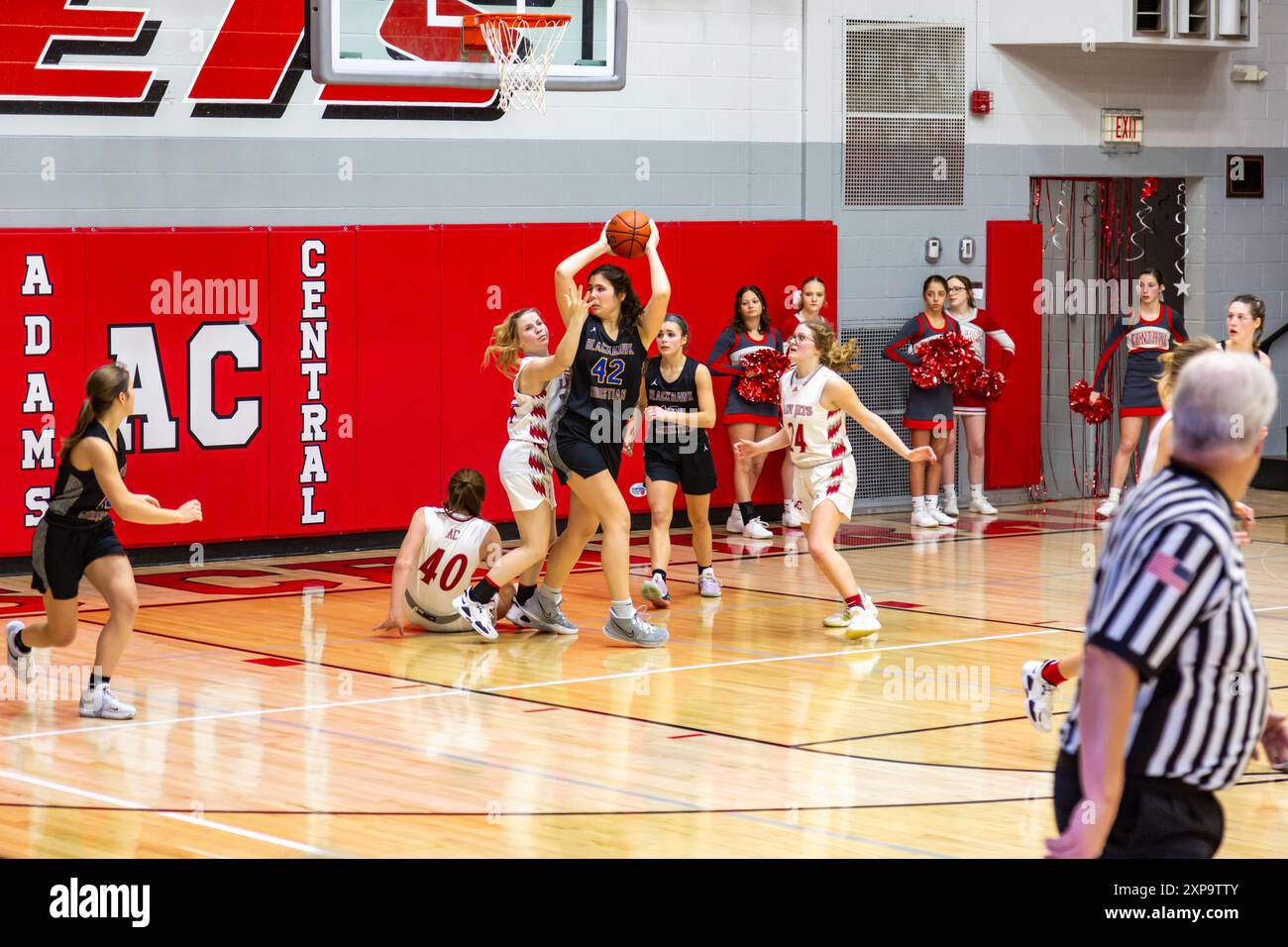 A Blackhawk Christian player looks to pass the ball after a rebound in an IHSAA girls basketball game at Adams Central High School near Monroe, IN USA. Stock Photo