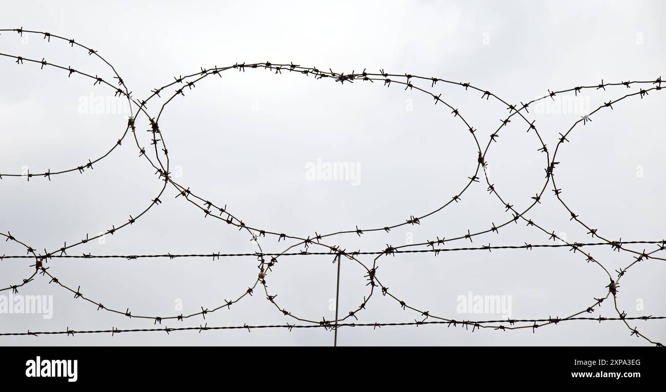 Barbed wire isolated on white Stock Photo