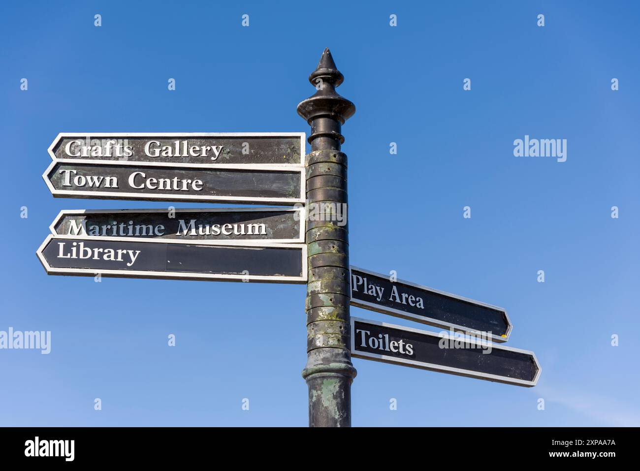 A pedestrian finger signpost in the coastal village of Appledore, Devon ...
