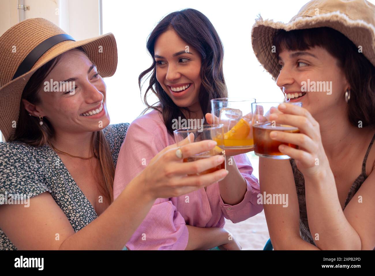 Three woman toasting ,dinner happy friends Stock Photo