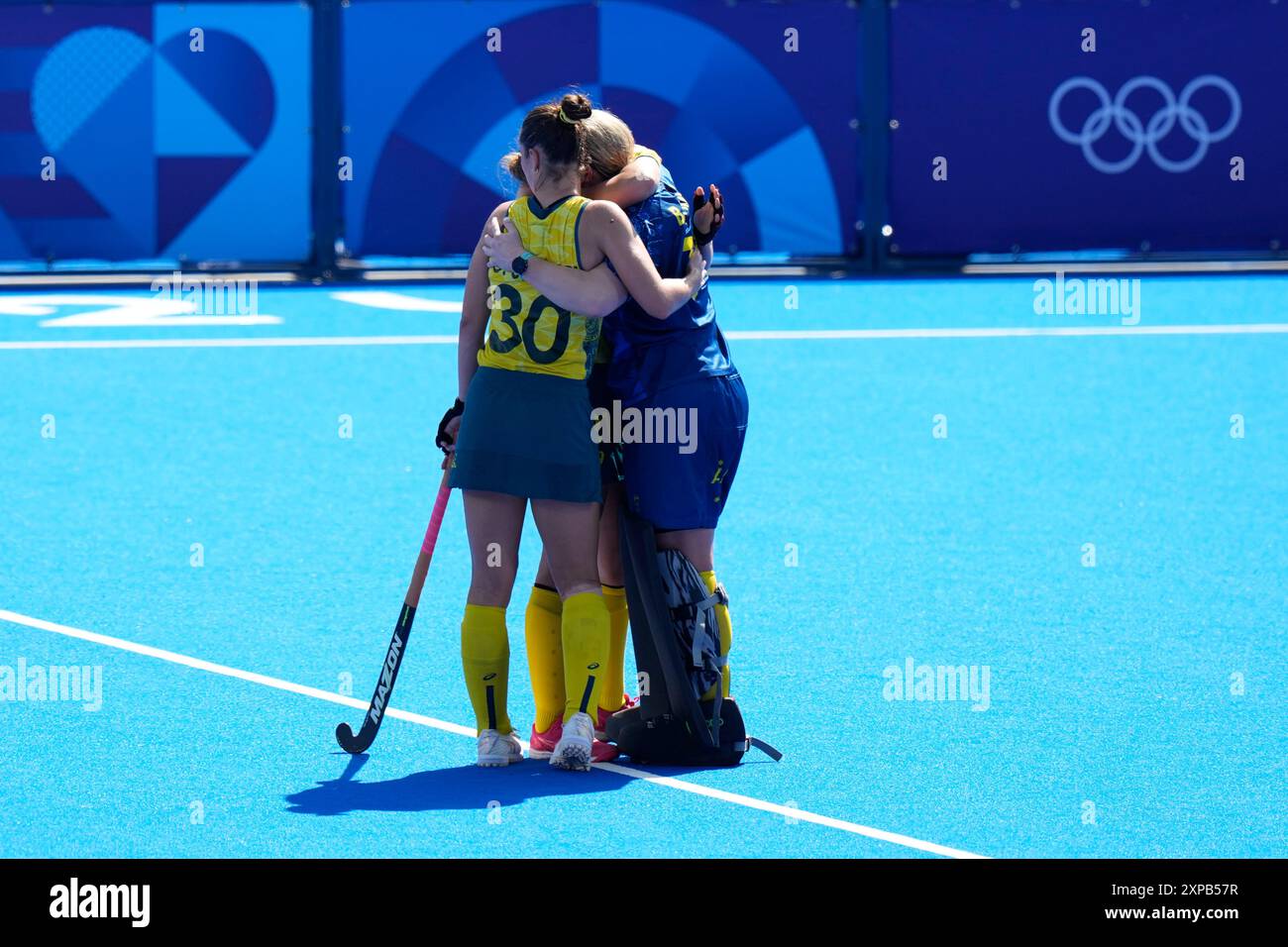 Australia's Grace Stewart, left, and teammates comfort each other after ...
