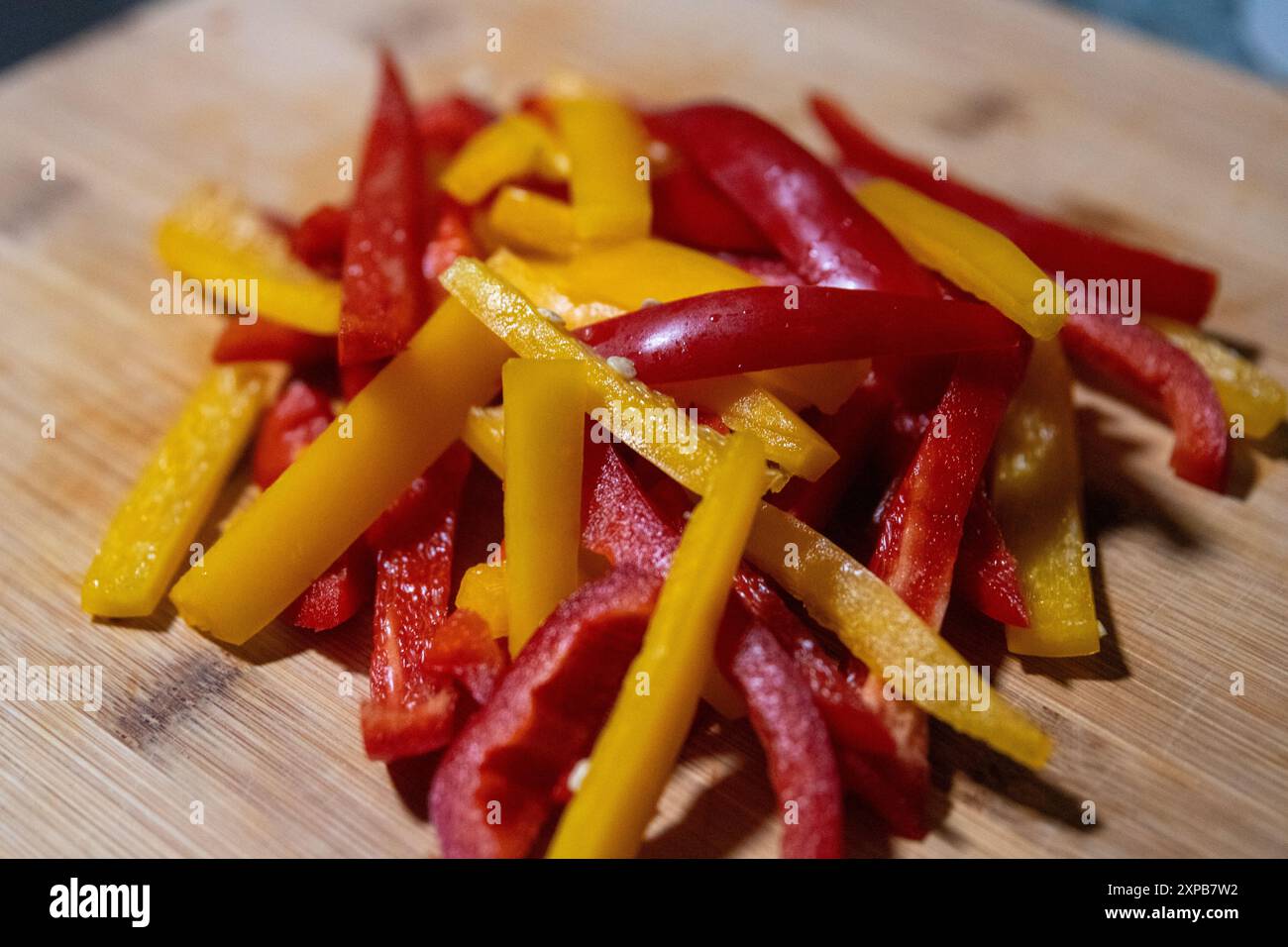 Red and Yellow Sliced Bell Peppers for cooking Stock Photo - Alamy
