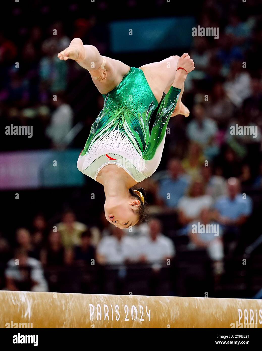 China's Zhou Yaqin performs during the women's balance beam final at