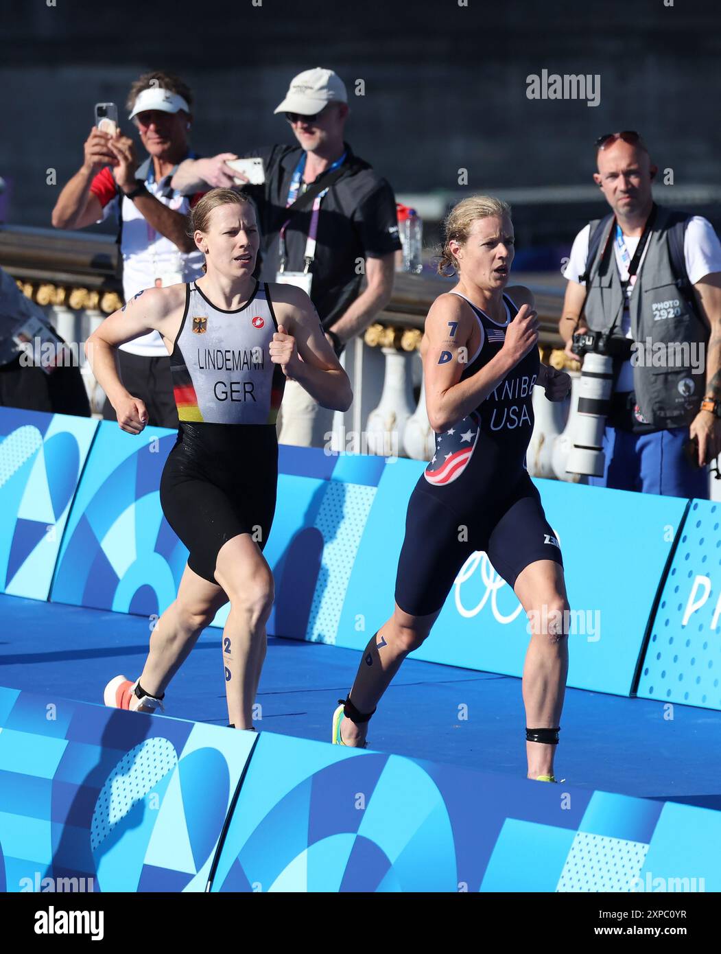 Paris, France. 05th Aug, 2024. Team USA's Taylor Knibb leads Germany's Laura Lindemann in the Mixed Team Triathlon at Port Alexandre III bridge on the tenth day of the Paris Olympics on Monday, August 05, 2024. Photo by Hugo Philpott/UPI Credit: UPI/Alamy Live News Stock Photo