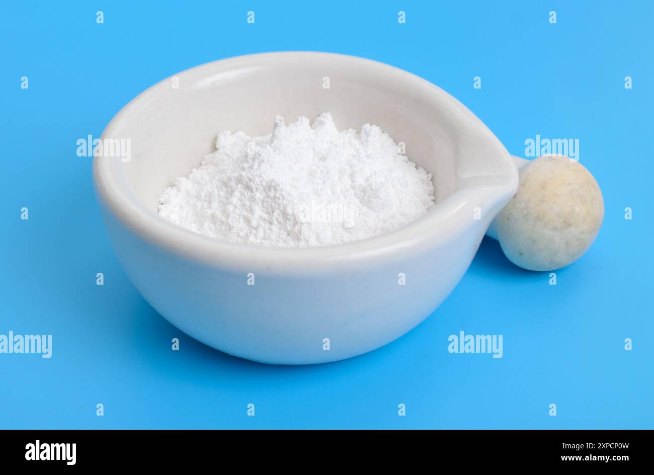 Magnesium oxide MgO, or magnesia powder. Stock Photo