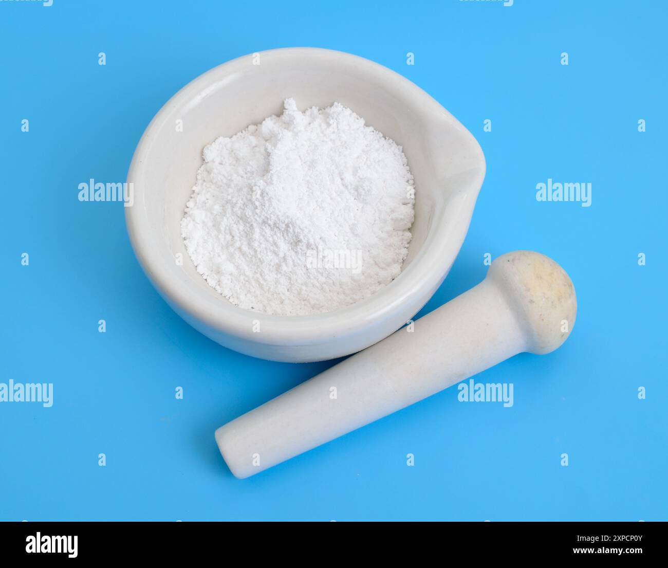 Magnesium oxide MgO, or magnesia powder. Stock Photo