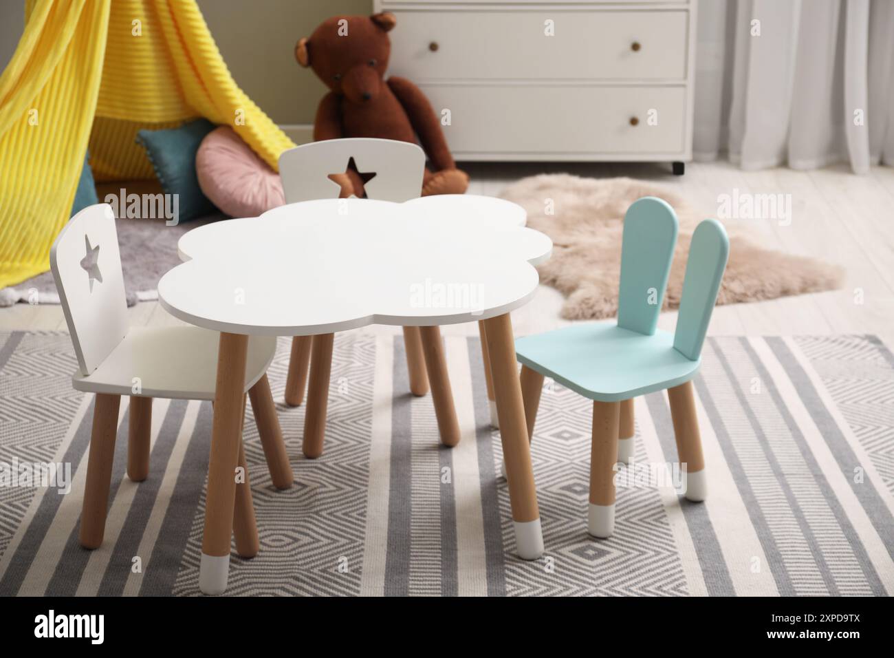 Stylish child room interior with table and chairs Stock Photo - Alamy